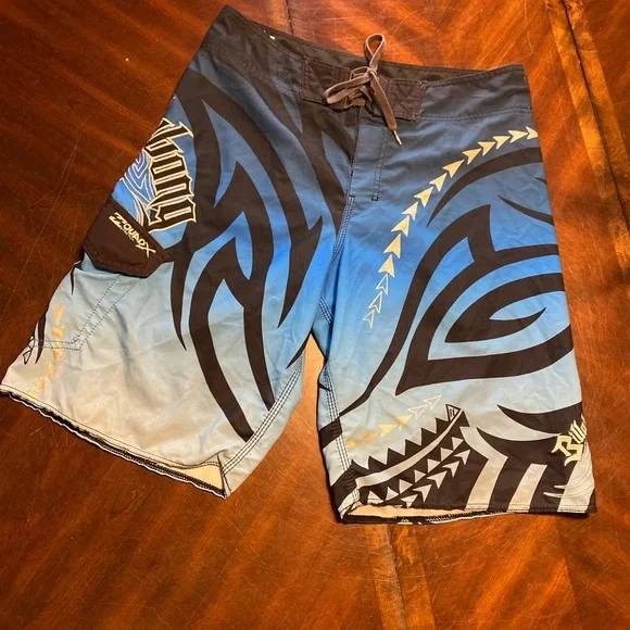 Billabong Blue and Black Board Shorts with Tribal Patterns - Picture 1 of 5